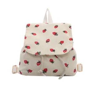 Corduroy backpack for women featuring red strawberry print and drawstring closure