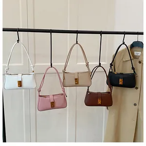 Variety of minimalist leather underarm bags in five colors with stylish knotted straps