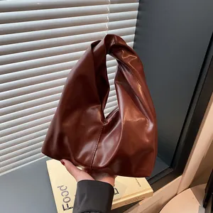 Moderne dunkelbraune Leder-Eimertasche mit Knotengriff-Design für Damenmode