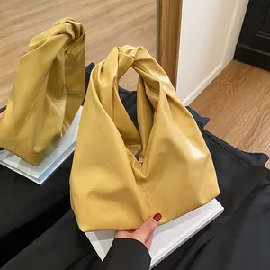Schicke senfgelbe Plissee-Beuteltasche mit modischem Knotengriff und weicher Lederstruktur