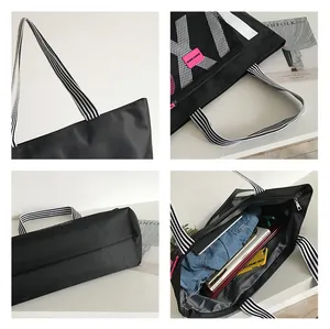 Detail view of large capacity tote bag showing spacious interior with mesh pockets