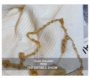 Macro detail of shining gold chain shoulder strap on a rhinestone mini handbag