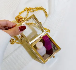 Detail showing internal capacity of the crystal rhinestone mini bag with gold chain