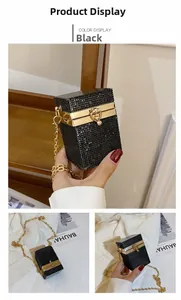 Detail of black rhinestone evening clutch bag with gold chain strap and metal frame
