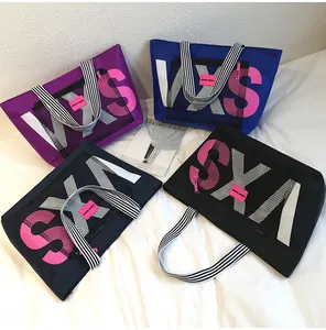 Multi-color sports tote bags with mesh pockets and striped handles for beach travel