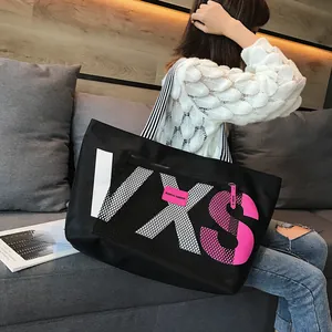 Black large capacity waterproof tote bag with VXS letters and mesh pocket detail