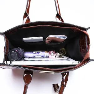 Interior view of brown crocodile texture tote bag showing large capacity storage space