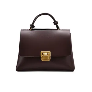 Klassische braune Vintage-Trapeztasche mit goldenem Schloss und einzelnem Tragegriff