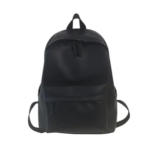 Minimalist matte black PU leather backpack for women with front zipper pocket and sleek design