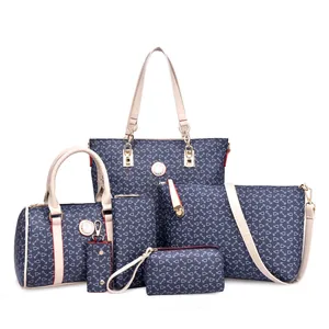 Detailed 6-piece set of navy floral print tote bags and matching purses with gold hardware