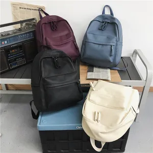 Neutral vintage PU leather backpack in four colors with front zipper pocket and soft texture