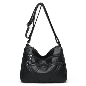 Women's black PU leather crossbody bag with quilted pattern and multi-zipper pockets