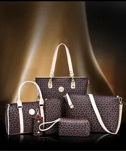 Detailed six-piece handbag set featuring coffee canvas with white handles and gold hardware
