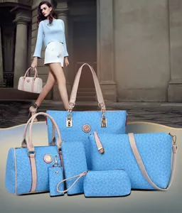 Detailed six-piece light blue tote bag set with geometric patterns and golden emblems