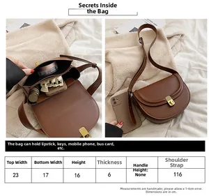 Detailed size chart and internal capacity of the brown PU leather saddle shoulder bag