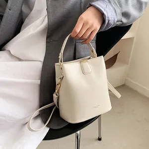 Fashion cream white bucket handbag for women with gold hardware and top handle strap