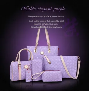 Detail of 6-piece purple handbag set featuring bone-pattern prints and gold hardware