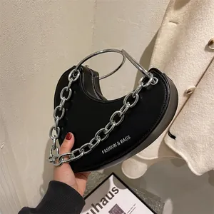 Chic heart-shaped faux leather shoulder bag with chunky silver chain and ring handle