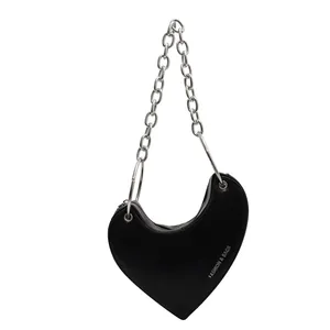 Fashionable heart-shaped black shoulder bag with silver chain strap and metal rings