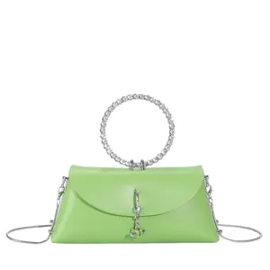Sac gelée vert néon avec poignée ronde en strass et bandoulière en chaîne argentée