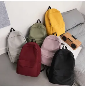 Detailed view showing multi-color selection of large capacity minimalist nylon backpacks
