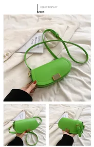 Detail view of a green PU leather crossbody bag featuring a golden metallic striped lock