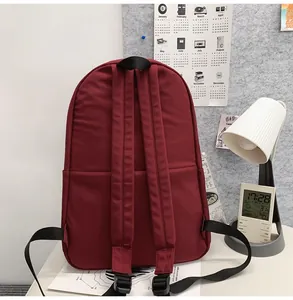 Detail view of the backpack back showing adjustable straps and hidden pocket