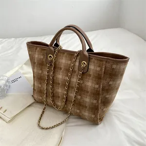 Large capacity plaid tote bag with brown leather handles and gold chain decoration