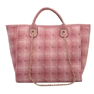 Pink patchwork tote bag with gold chain strap and large capacity bucket structure