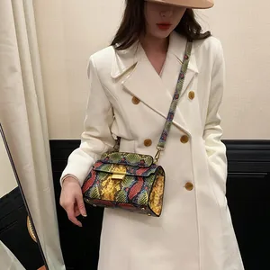 Chic multi-color snakeskin shoulder bag with gold buckle and stylish long strap