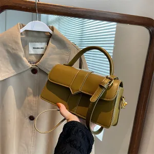 Olive green minimalist handbag in matte leather with top handle and gold metal hardware