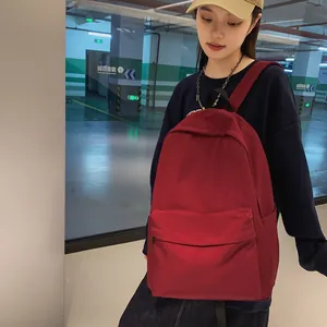 Minimalist deep red nylon backpack for students, large capacity commuter school bag
