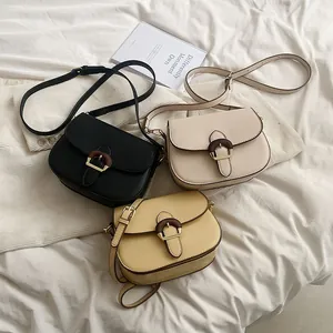 Fashionable minimalist saddle bag set in black, beige, and yellow with wooden buckles