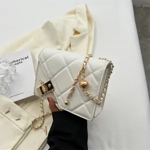 Quilted white leather crossbody bag with gold chain strap and decorative ball pendant