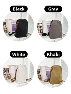 Détails des grands sacs en toile disponibles en noir, gris, blanc et kaki avec bandoulière