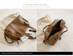 Detail view of brown vintage tote bag with main compartment and metal ring hardware