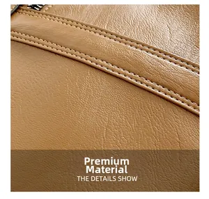 Detailed close-up of premium brown lychee grain leather with neat double-row stitching