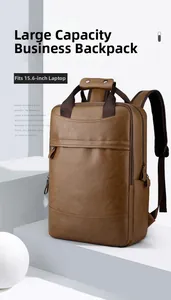 Macro view of brown PU leather business backpack fitting a 15.6 inch laptop compartment
