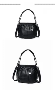 Vues détaillées d'un sac à main noir froncé avec fermeture éclair et bandoulière