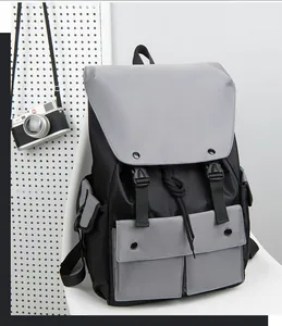 Detail of waterproof nylon backpack with dual buckle closure and multi-pocket design