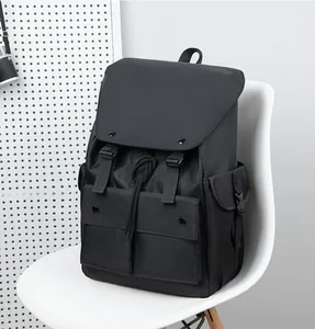 Detail of waterproof nylon backpack with drawstring closure and functional front pockets