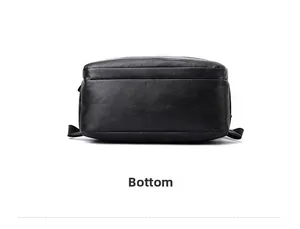 Detail view of the durable black leather backpack bottom with reinforced stitching