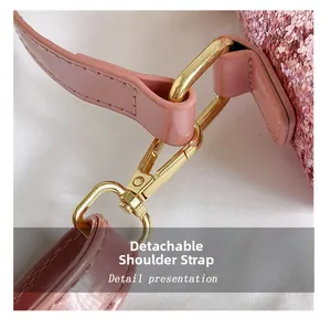 Detail of pink sequin bag with gold-tone metal hook and detachable leather strap
