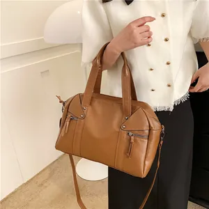 Brown oil-wax leather tote handbag with tassel zippers and detachable shoulder strap