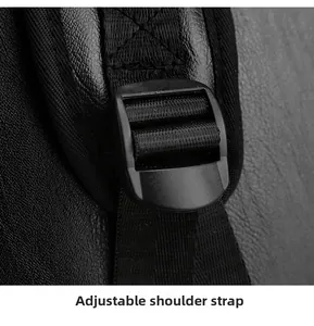 Detail of adjustable shoulder strap with plastic buckle on black leather backpack