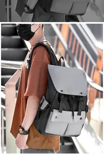 Outdoor nylon backpack with color-block design shown on model in urban street setting