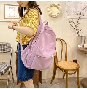 Detail of purple corduroy backpack texture and side pocket for student school use