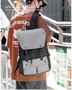 Close-up of dual front pockets and buckle closure on a durable nylon backpack