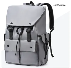Detailed view of the grey water-resistant nylon backpack with buckle closure