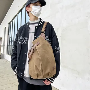 Fashionable khaki canvas crossbody sling bag for men in a trendy teardrop shape design